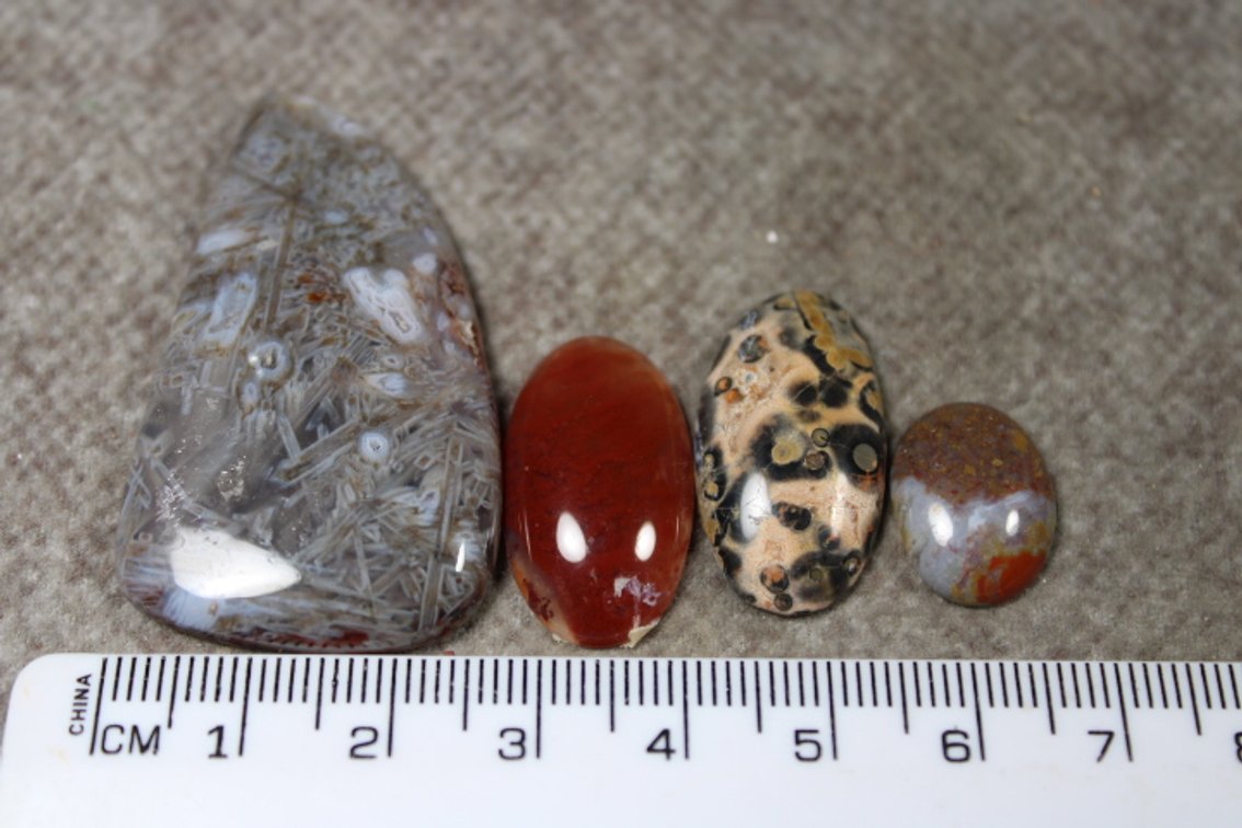 An assortment of four cabochons