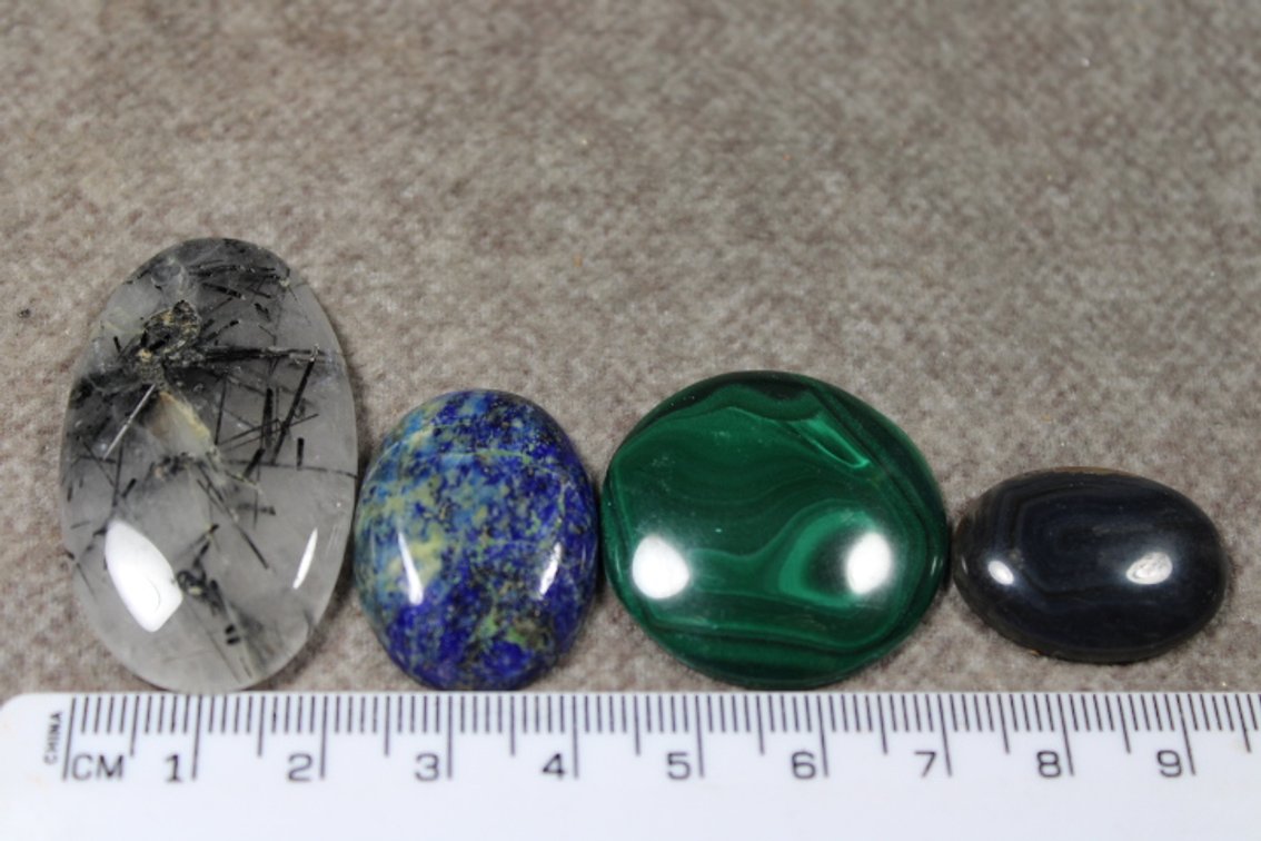 An assortment of four cabochons