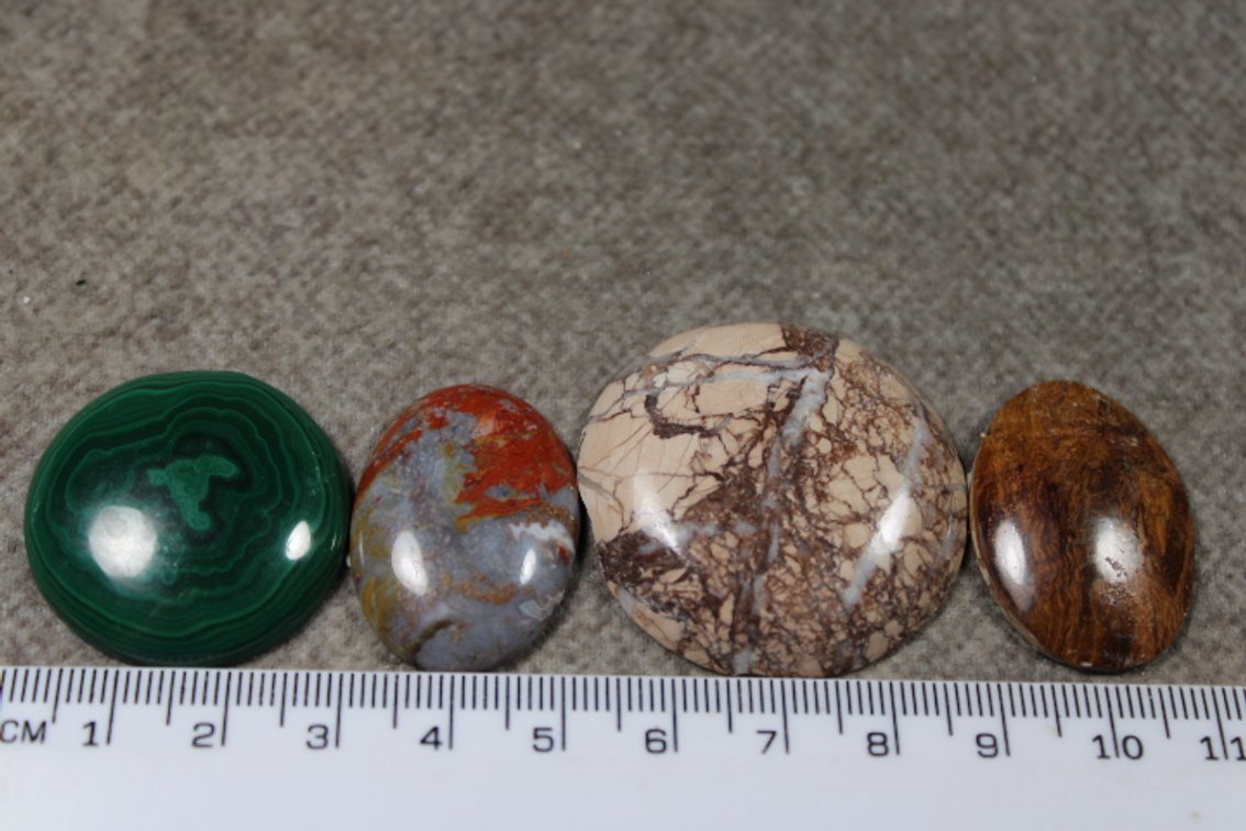 An assortment of four cabochons