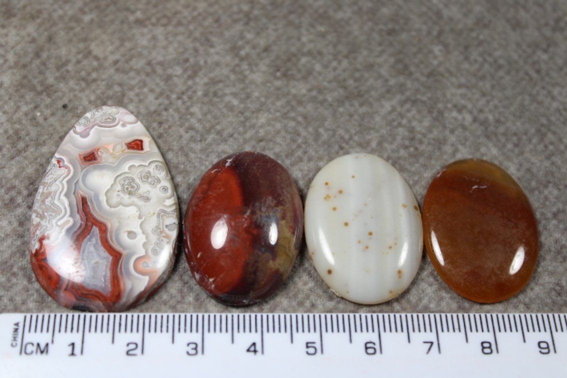An assortment of four cabochons
