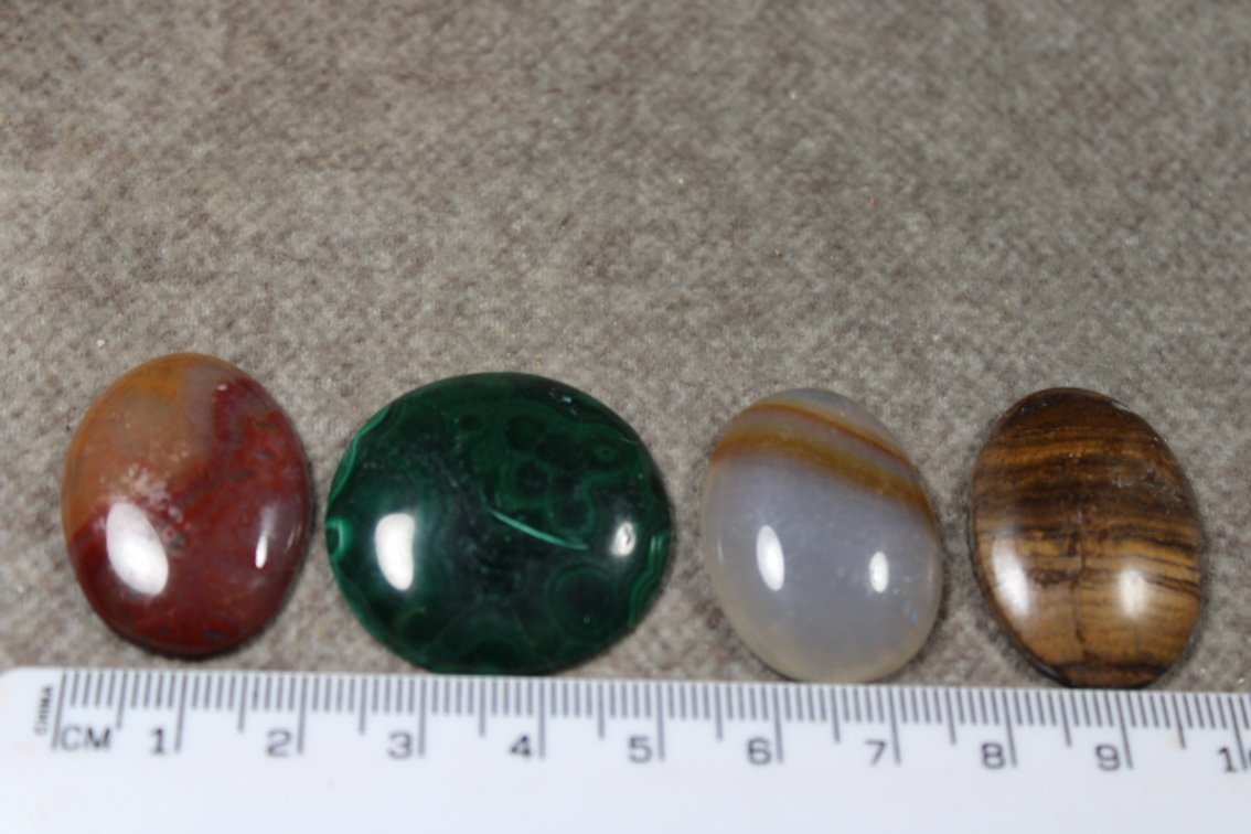 An assortment of four cabochons