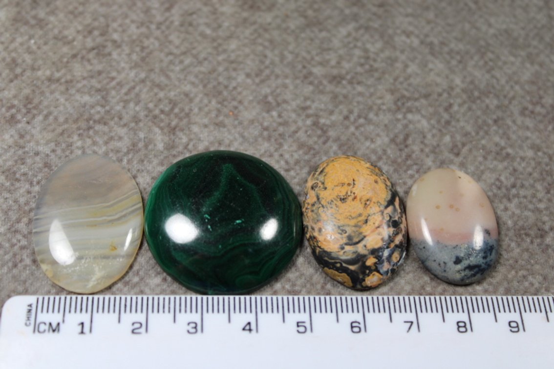 An assortment of four cabochons