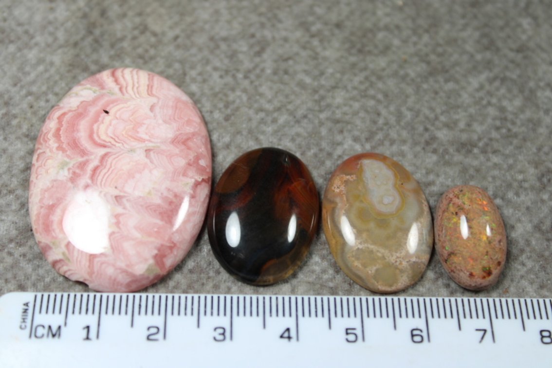 An assortment of four cabochons