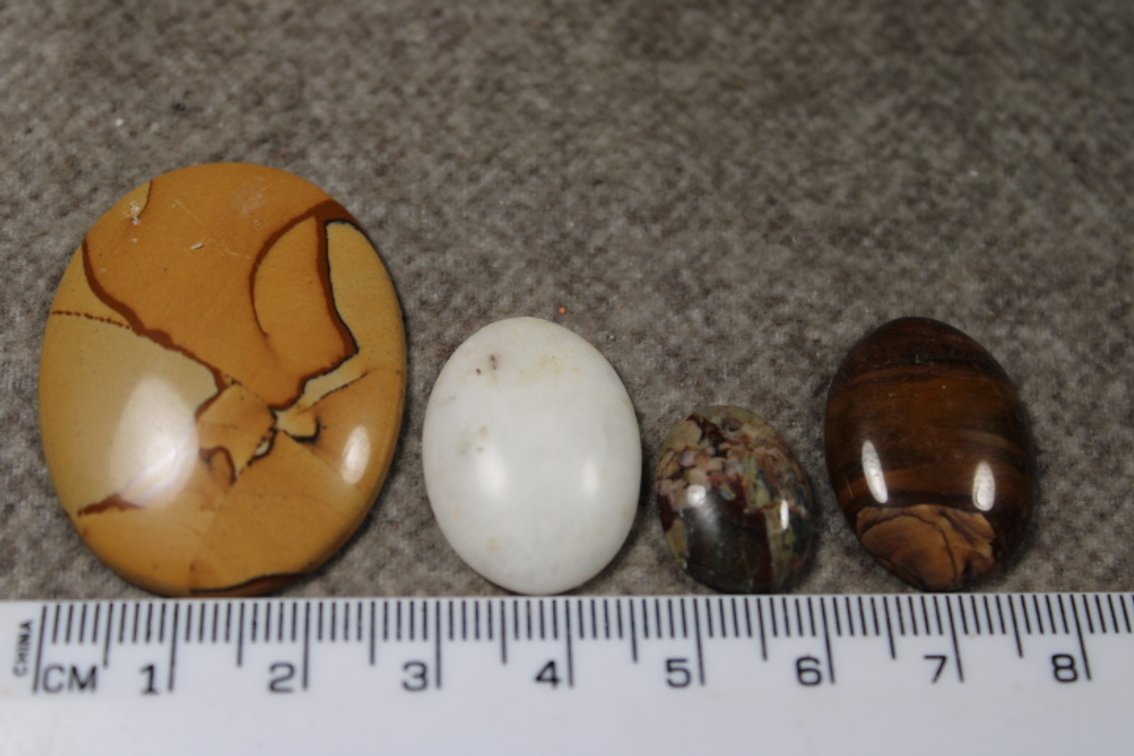An assortment of four cabochons