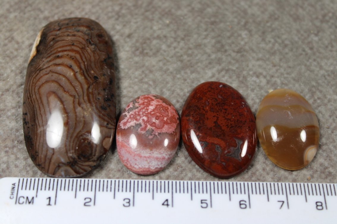 An assortment of four cabochons