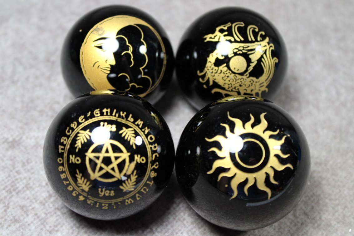 Four spheres with Wiccan symbols