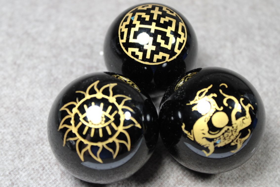 Three spheres with Wiccan symbols