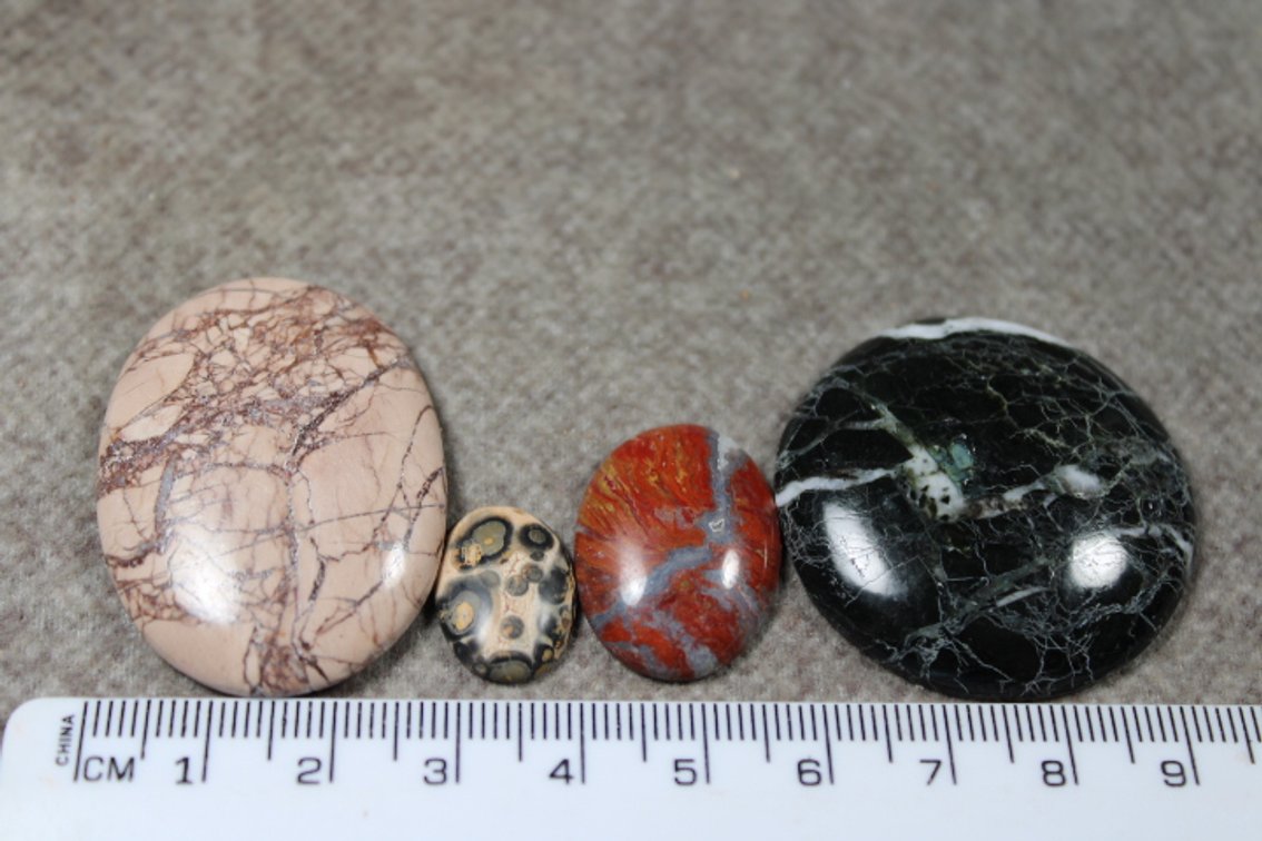 An assortment of four cabochons