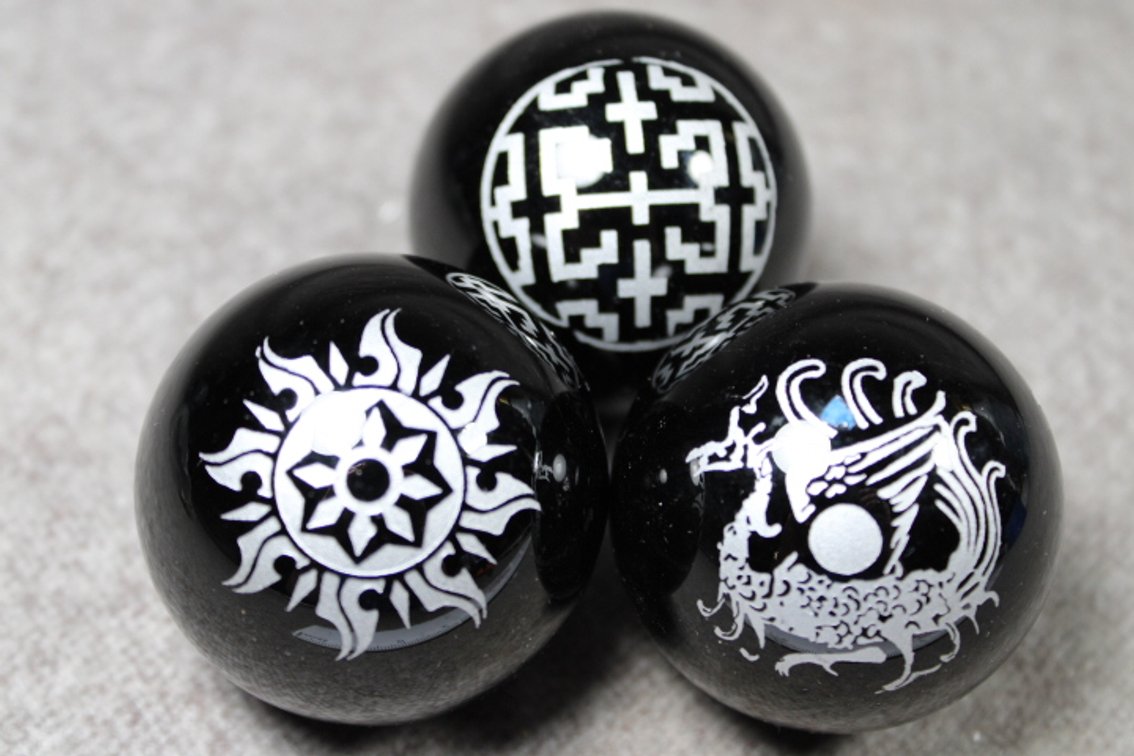 Three spheres with Wiccan symbols