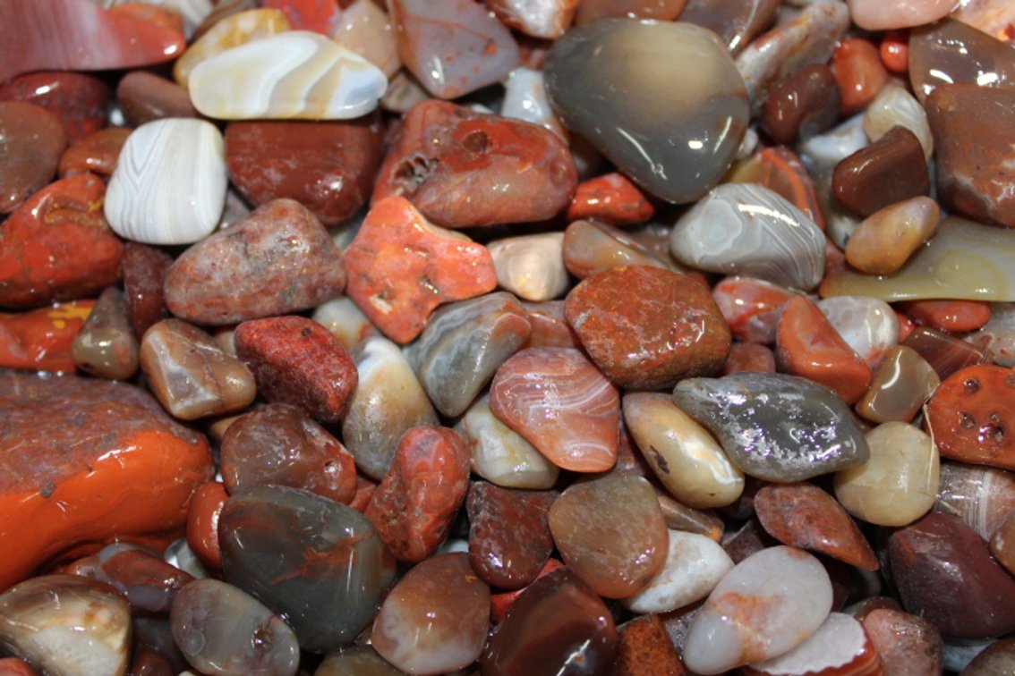 A 9 lb 9 oz flat of Lake Superior Agates. The agates have a satin finish, can be left as is or put back in tumbler for a high polish