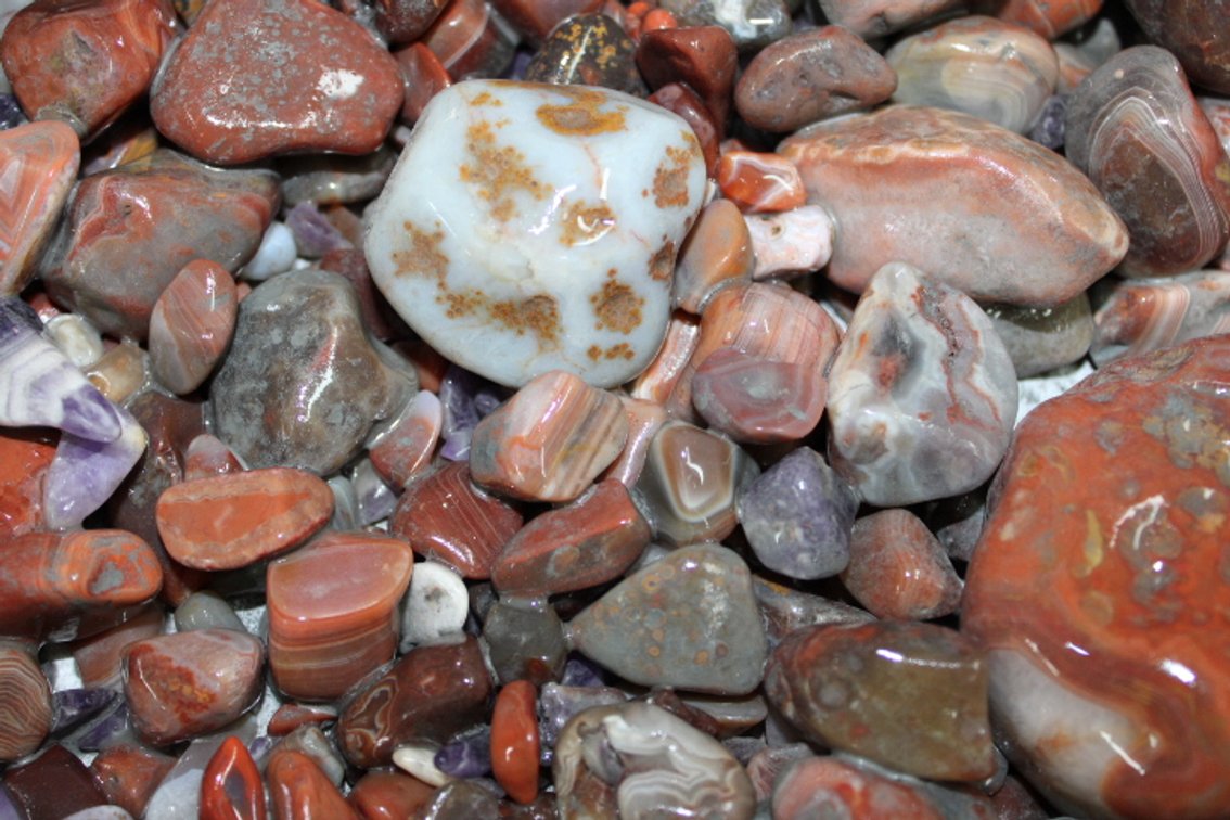 A 10 lb flat of mostly Lake Superior Agates. The agates have gone through the first stage of tumbling giving them a satin finish. They can either be left as is or put back into the tumbler for a high polished