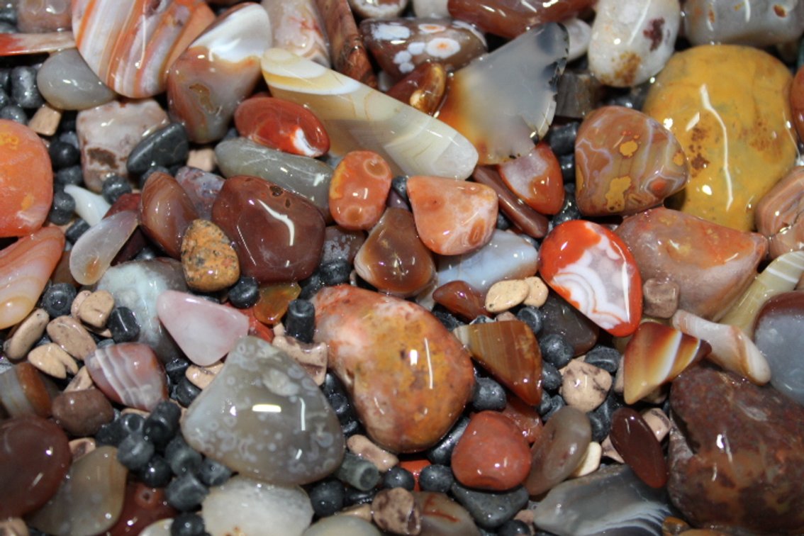 A 9 lb 6 oz flat of Lake Superior Agates. The agates have gone through the first stage of tumbling giving them a satin finish. They can either be left as is or put back into the tumbler for a high polish