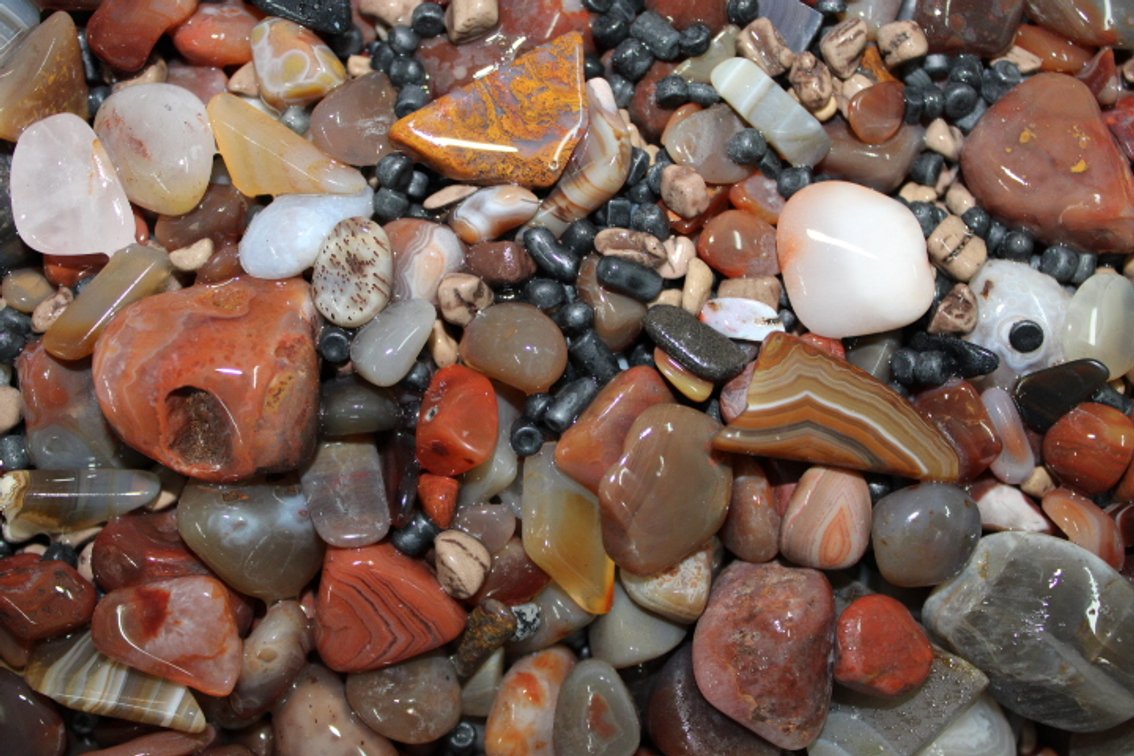 A 10 lb flat of Lake Superior Agates. The agates have gone through the first stage of tumbling giving them a satin finish. They can either be left as is or put back into the tumbler for a high polish