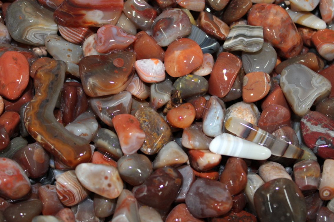 A 9 lb 2 oz flat of Lake Superior Agates. The agates have gone through the first stage of tumbling giving them a satin finish. They can either be left as is or put back into the tumbler for a high polish