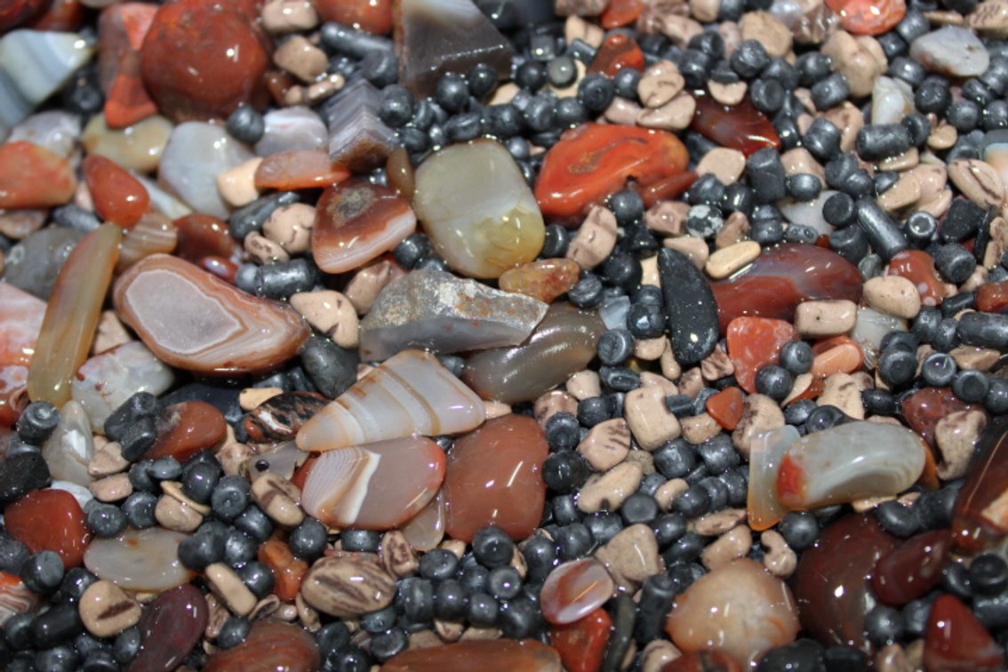 A 10 lb 5 oz flat of Lake Superior Agates and tumbling media. The agates have gone through the first stage of tumbling giving them a satin finish. They can either be left as is or put back in the tumbler for a higher polish