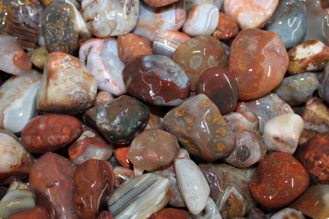 A 10 lb 7 oz flat of mostly Lake Superior Agates. The agates have gone through the first stage of tumbling giving them a satin finish. They can either be left as is or put back into the tumbler for a high polish