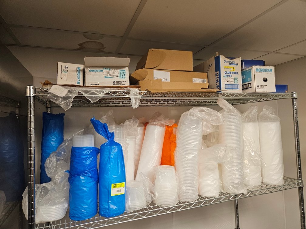 Assorted Paper Products on Top 2 Shelves