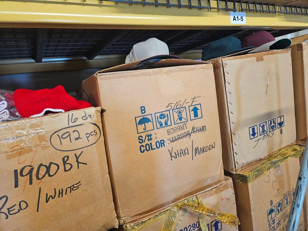 16 Cases Assorted Hats, 144 Per Case, Colors include Maroon/Khaki, Black/Spruce, Navy/Plum, White, More