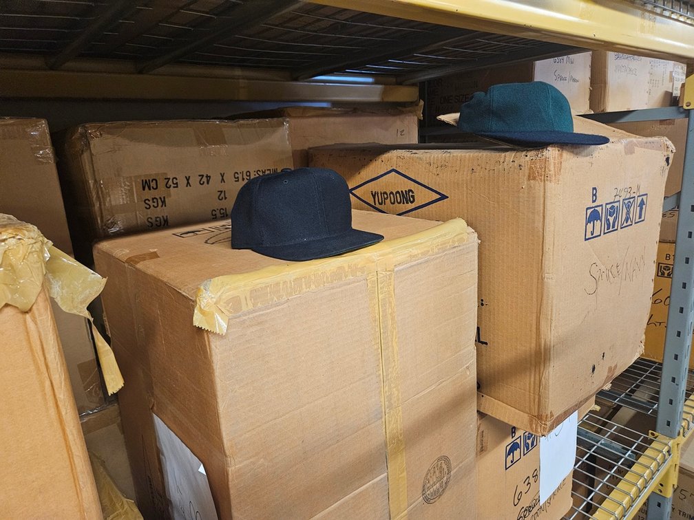 15 Cases Assorted Hats, 144 Per Case, Colors include Spruce/Navy, Black, Black/Red, Black/Gold, More
