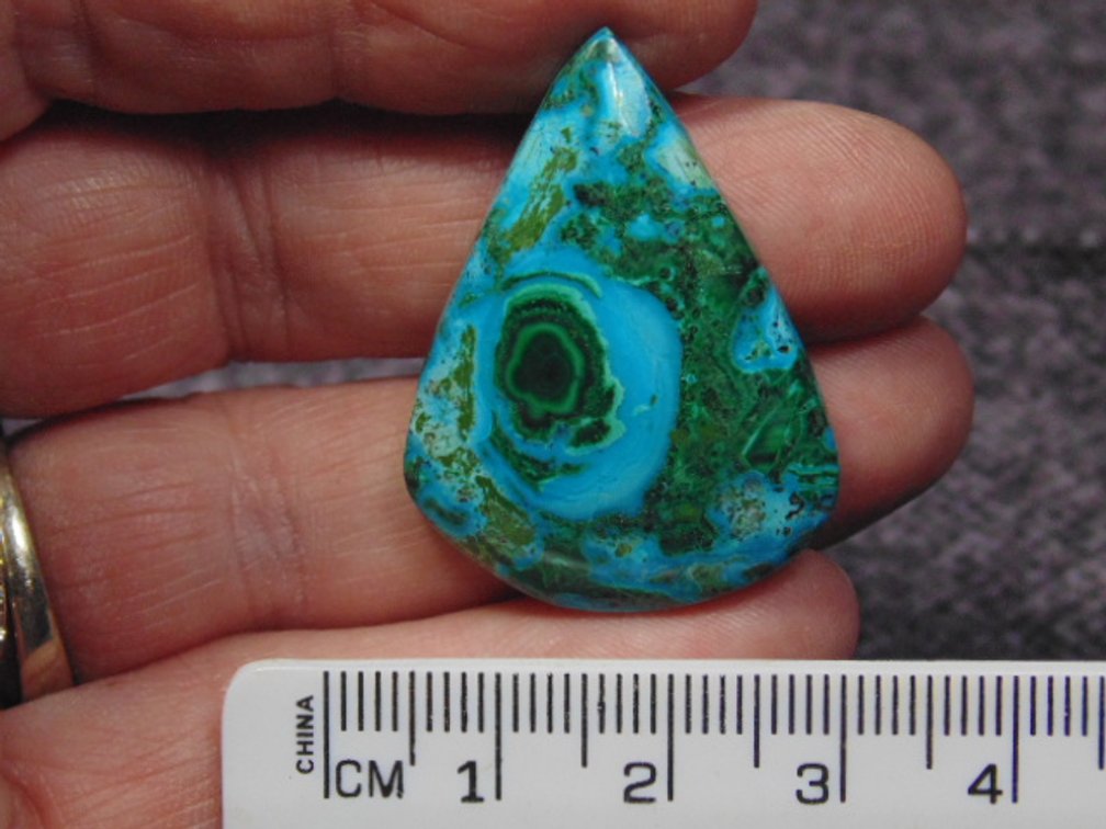 A teardrop Malachite/Chrysocolla cab, weighs 8.3 grams