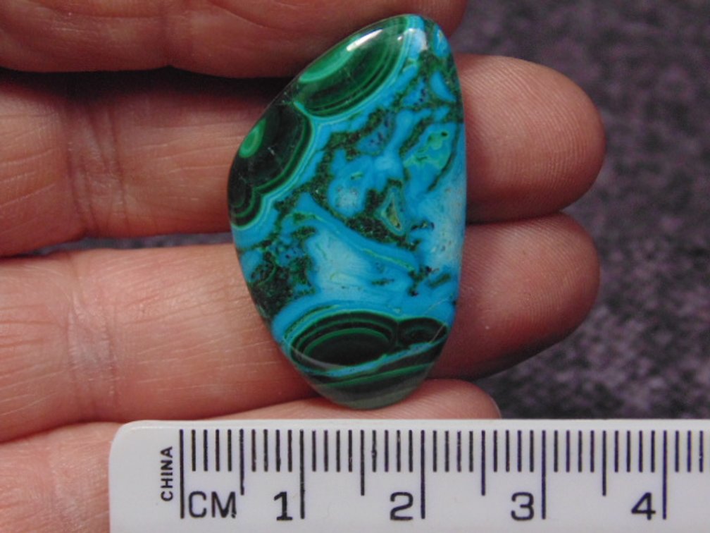A freeform Malachite/Chrysocolla cab, weighs 7.3 grams
