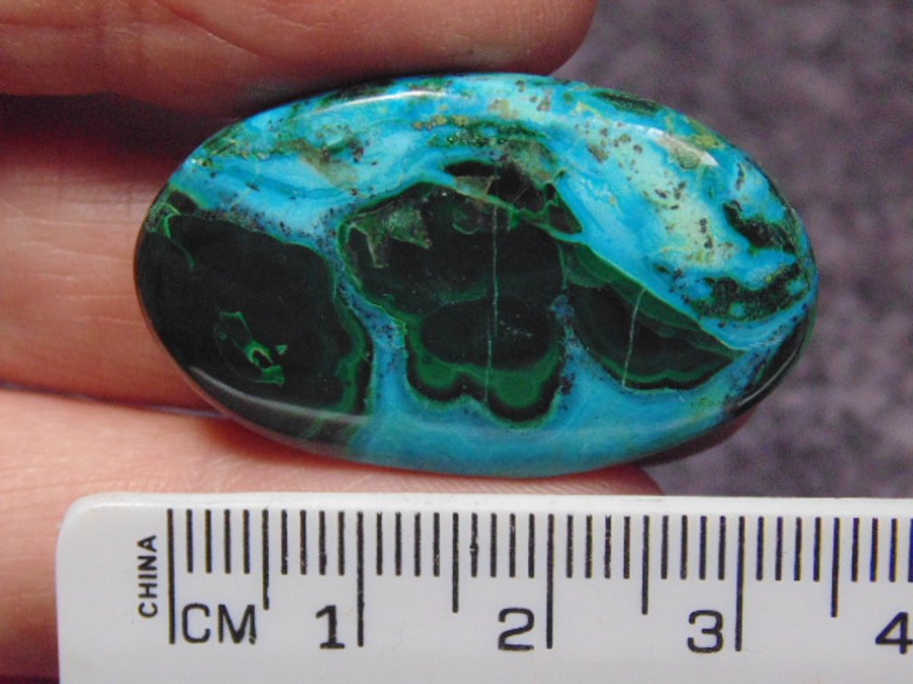 A oval Malachite/Chrysocolla cab, weighs 8.7 grams