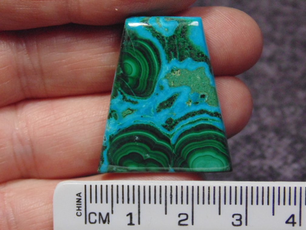 A freeform Malachite/Chrysocolla cab, weighs 8.7 grams