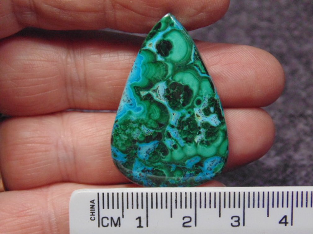 A teardrop Malachite/Chrysocolla cab, weighs 9.4 grams