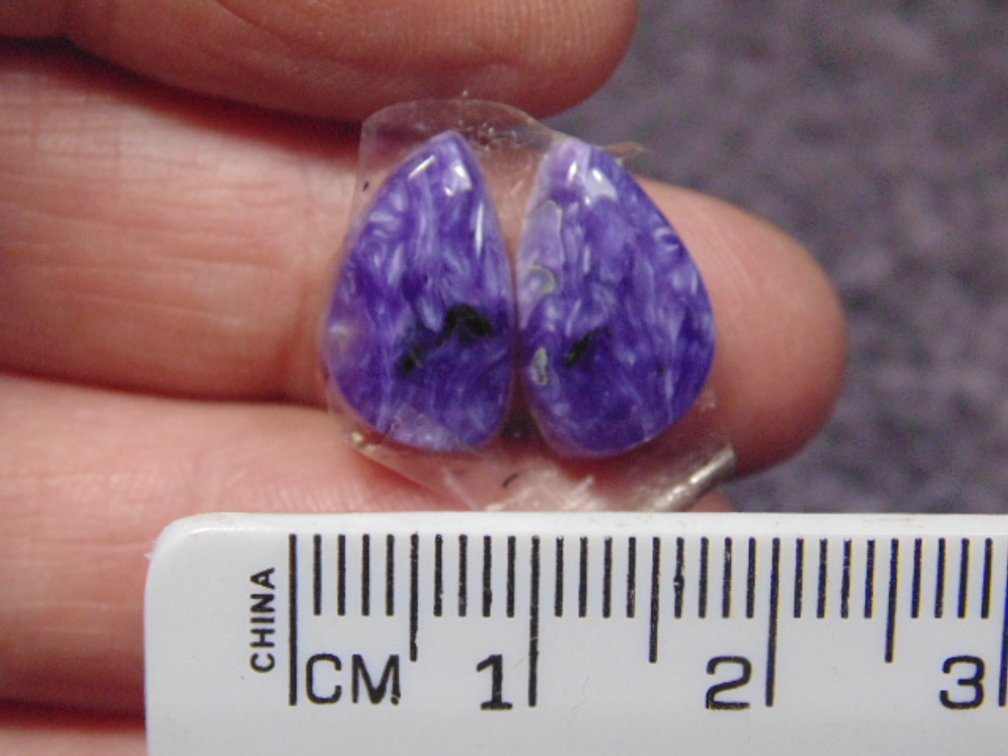A pair of matching freeform Lepidolite cabs, weighs 1.9 grams