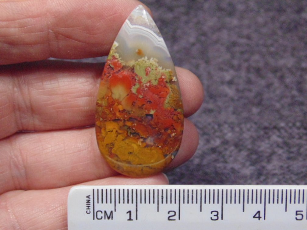 A teardrop Agate cab, weighs 7.4 grams
