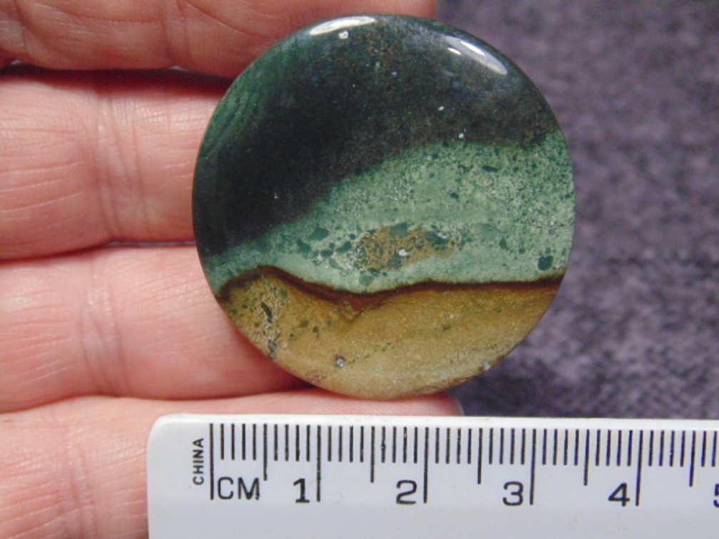 A round Jasper cab, weighs 12.1 grams