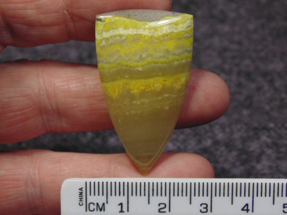 A shield shaped Bumblebee Jasper cab, weighs 8.6 grams