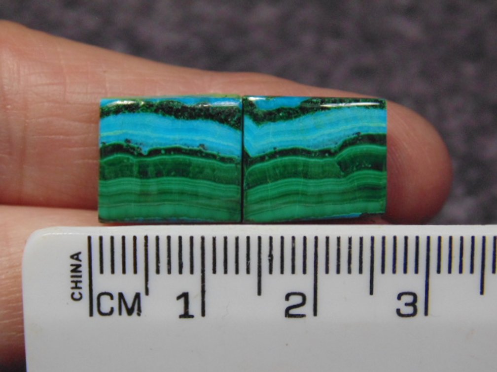 A pair of matching square shaped Malachite/Chrysocolla cabs, weighs 4.9 grams