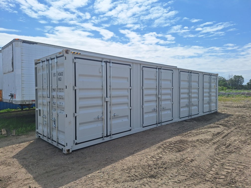 High Cube 40' Container, Four Doors. Details: Four Side Doors, One End Door, Lock Box, Side Forklift Pockets. Measures 8' Wide, 40' Long, 113" Tall.  Side Door Opening Measurement: 92" W x 100" T x 88" Deep, Weight 9,500lbs.