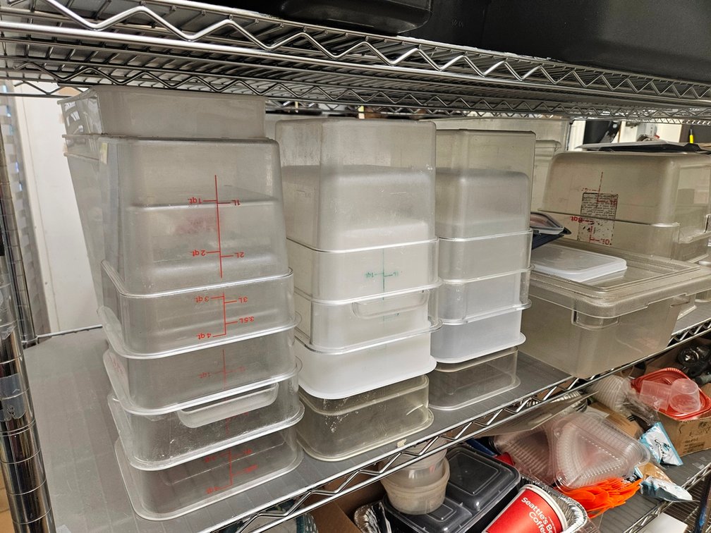 Assorted Plastic Measuring Containers and Lids