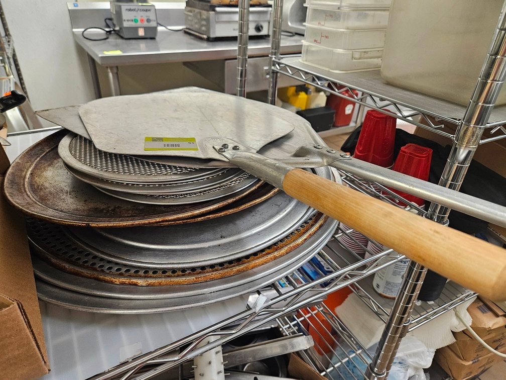 Assorted Pizza Pans and Pizza Paddles