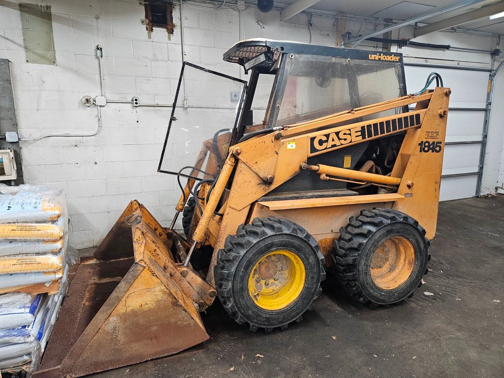 Case 1845 Skid Steer with 6' and 8' Buckets, Diesel Engine, 7084 Hours on Meter, Owner States "Runs and Drives"