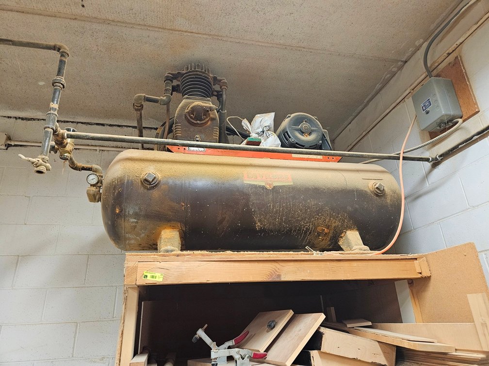 Devilbiss Air Compressor, Needs Work, Located on Top of a Shelf about 8 High, Buyer removes