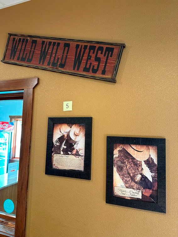 Wild west sign + two framed cowboy pictures