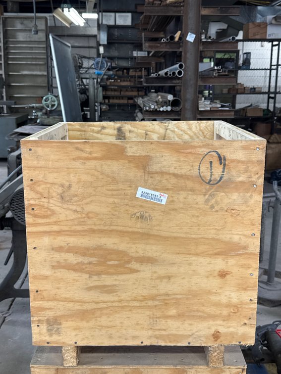 Welding Electrodes and Hydromatic Pump Component in Wooden Crate