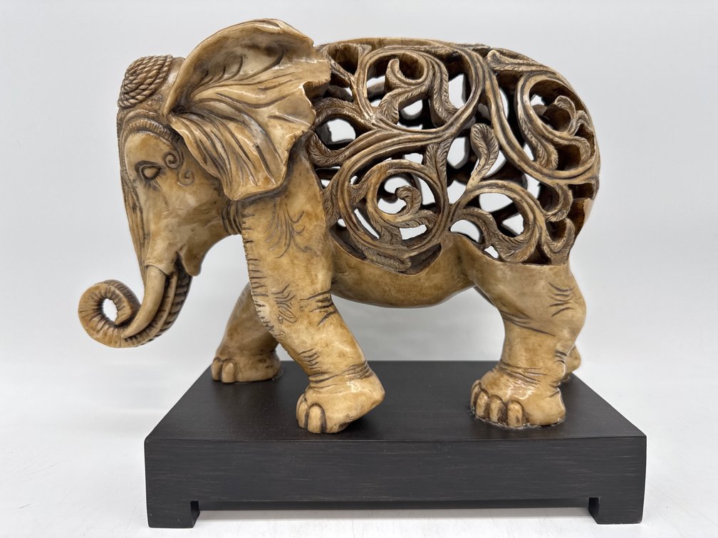 The Kindu Collection carved resin elephant on stand