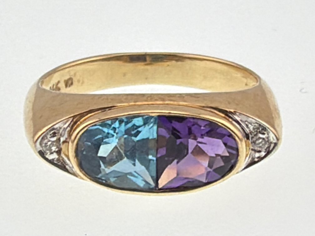 Attractive 14kt topaz, amethyst and diamond ring