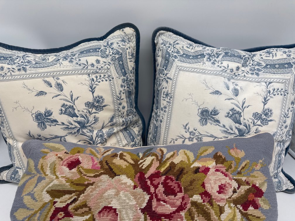 Pair of blue toile and velvet throw pillows, single needlepoint pillow