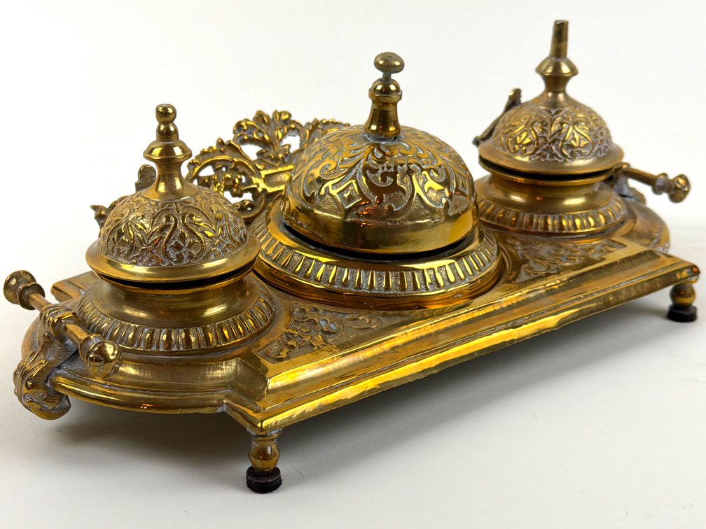 Ornate double brass inkwell with bell; GR