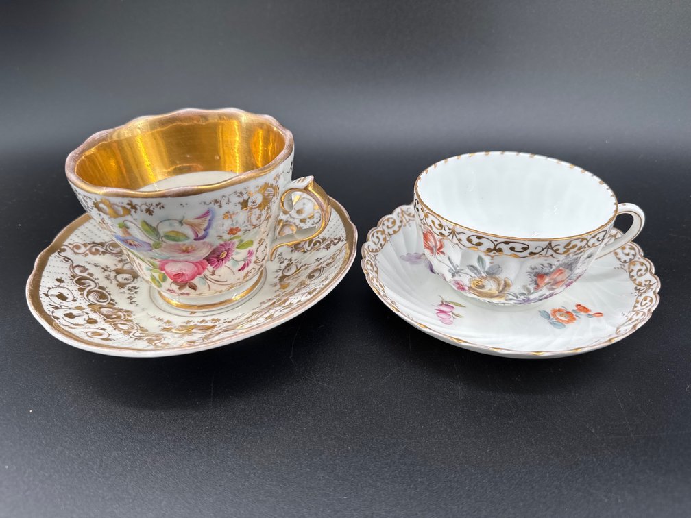KPM gilt and porcelain cup and saucer and Dresden c/s; GR
