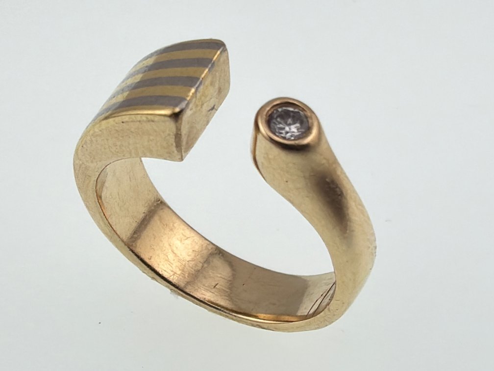 Two tone 14kt, diamond Modernist bypass band