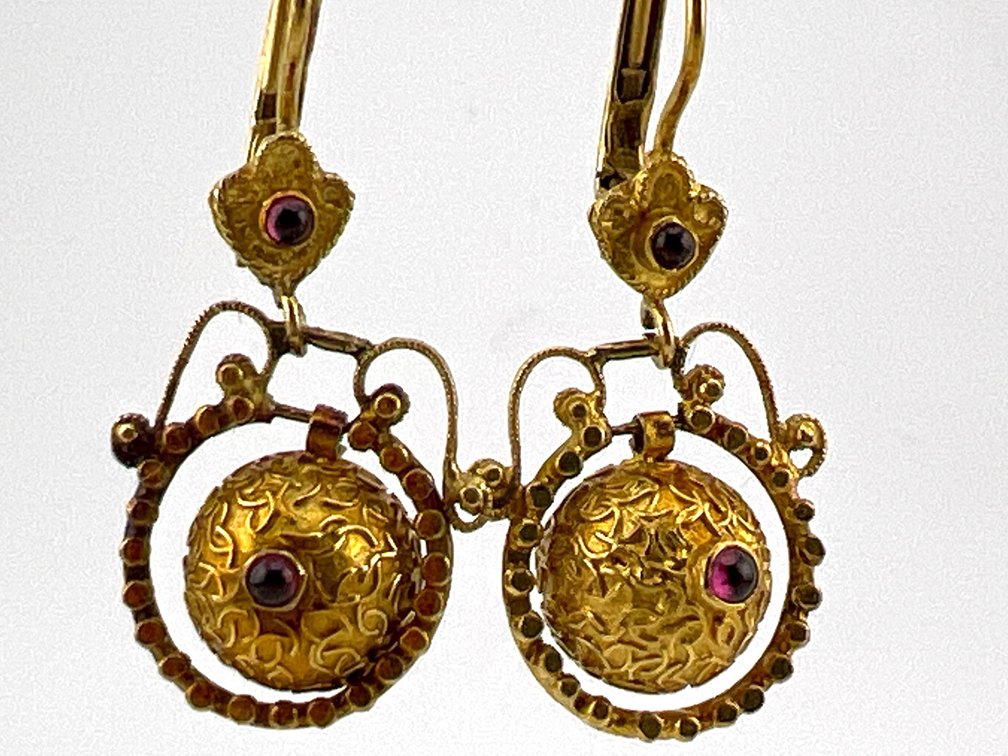 Pair of 14kt dangle textured balls with garnets