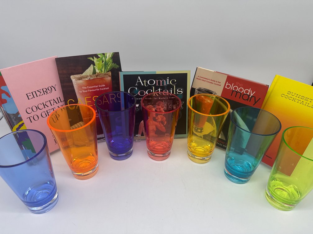 Plastic tumblers, flatware, cocktail recipe books