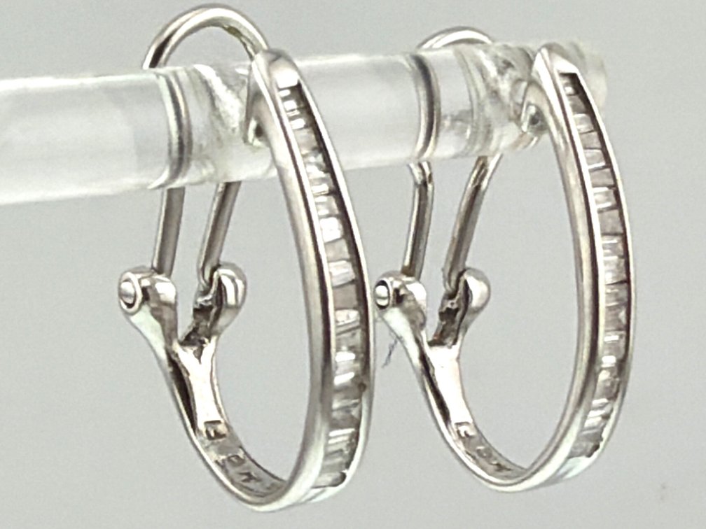 A pair of 14kt white gold, diamond earrings