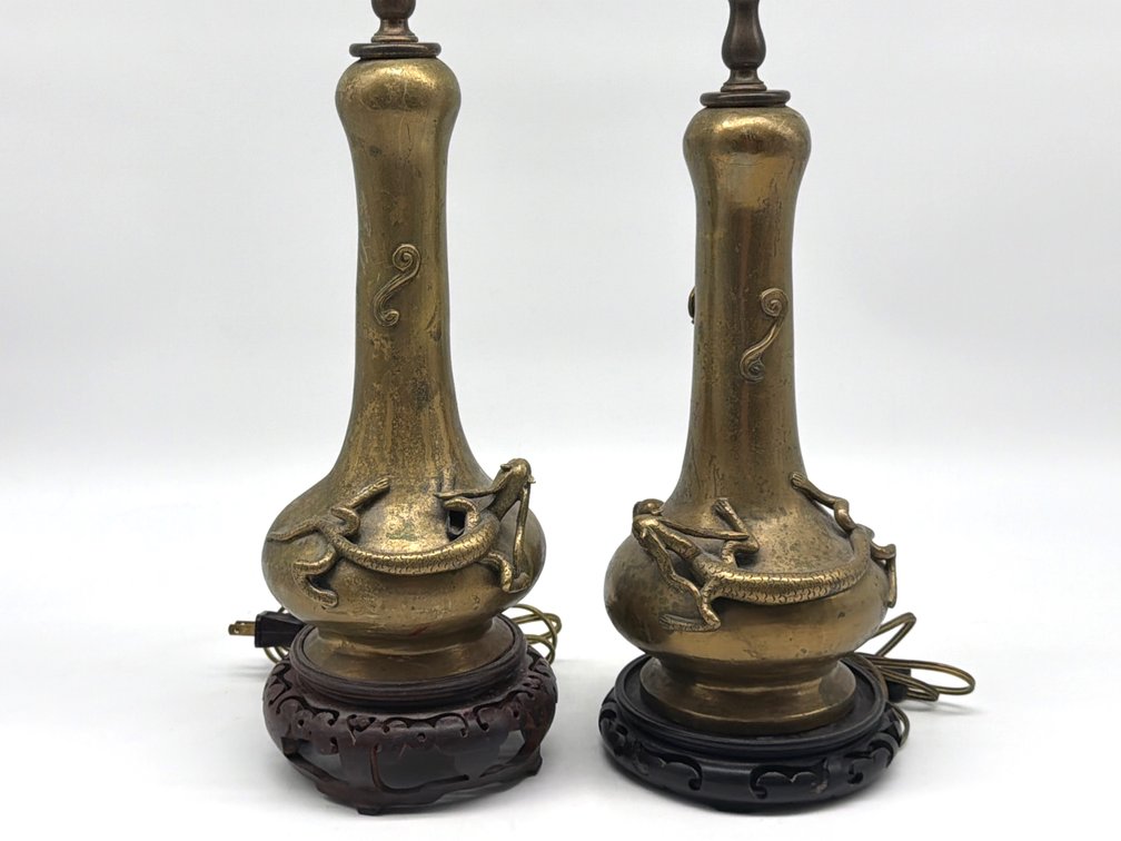 Pair of Chinese bronze dragon motif lamps